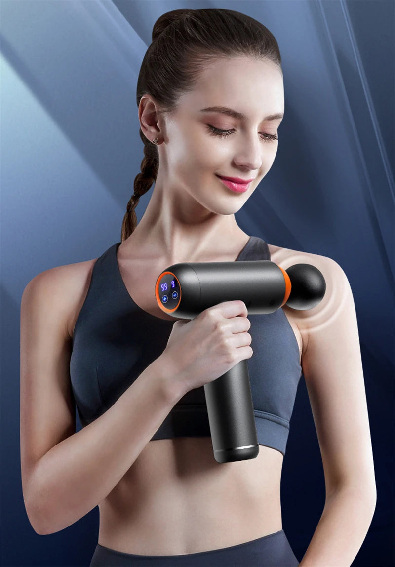 Sheluxe massage gun for back and leg pain relief used by woman on shoulder muscles