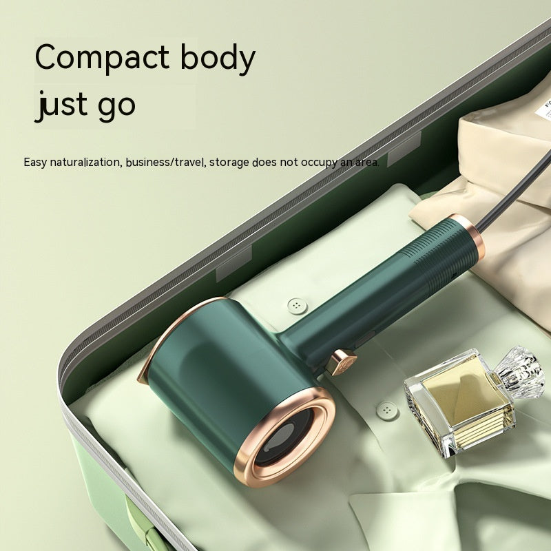 Nutritea portable garment steamer for travel in green and gold compact body inside suitcase