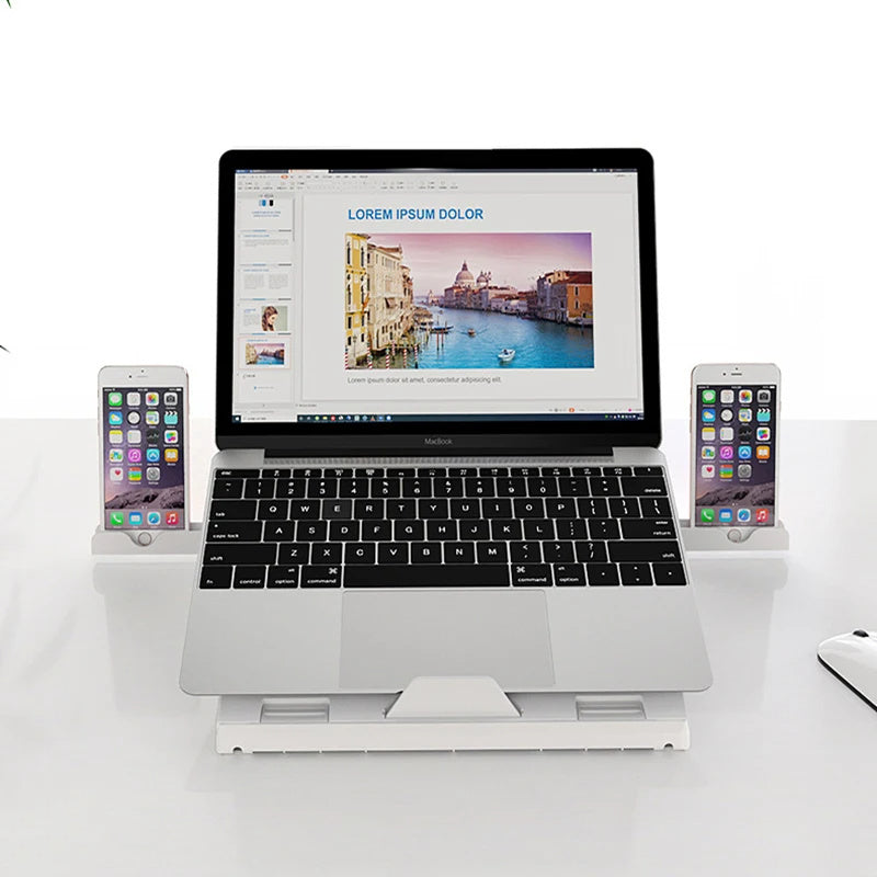 Sheluxe portable laptop stand adjustable with a laptop and two smartphones on a white desk