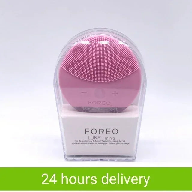Sheluxe silicone facial cleansing brush for sensitive skin in pink, packaged in clear protective case