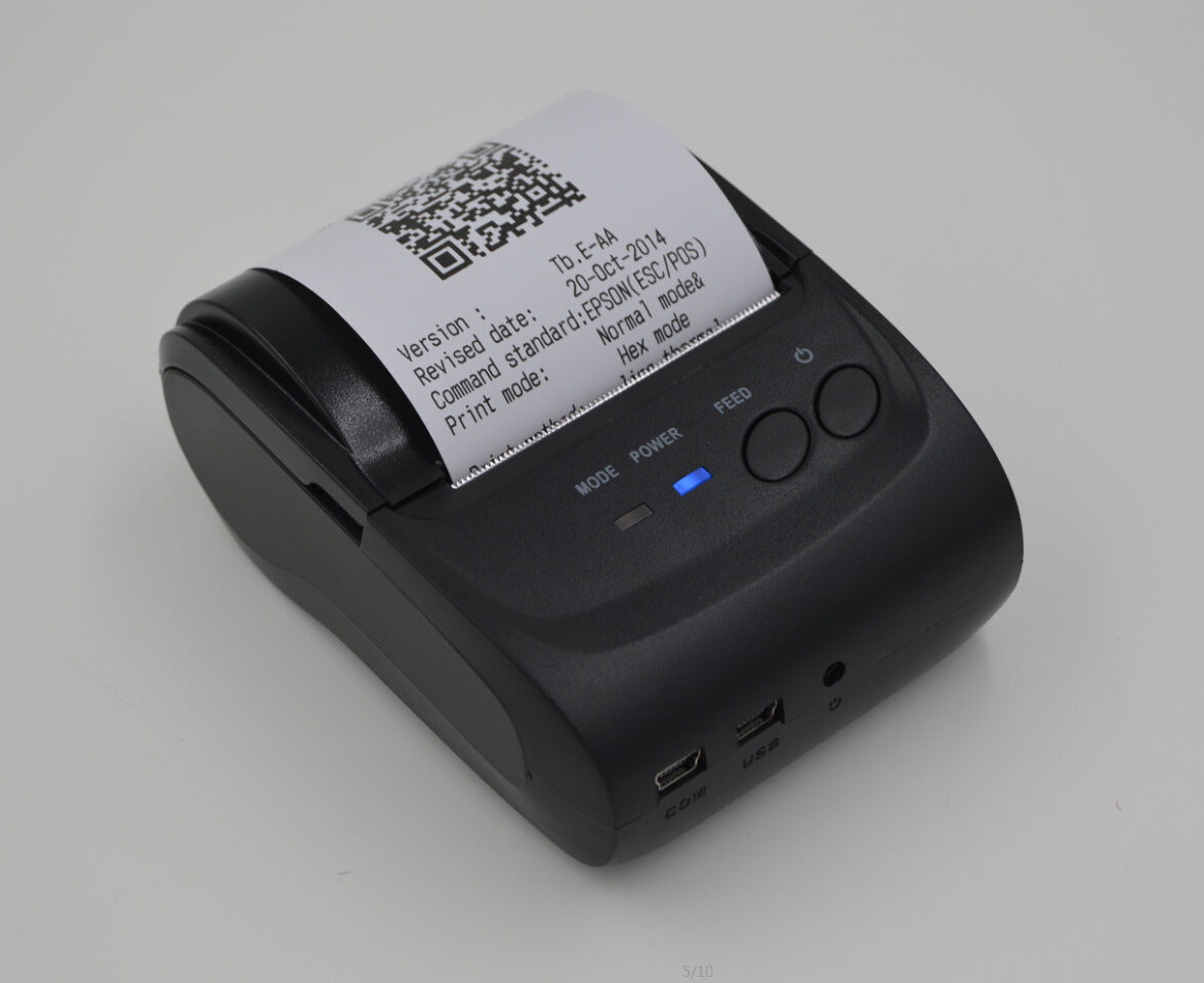 Sheluxe portable bluetooth printer in black printing a receipt with QR code and text